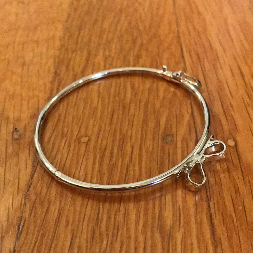 Kate Spade silver bow flex cuff bracelet